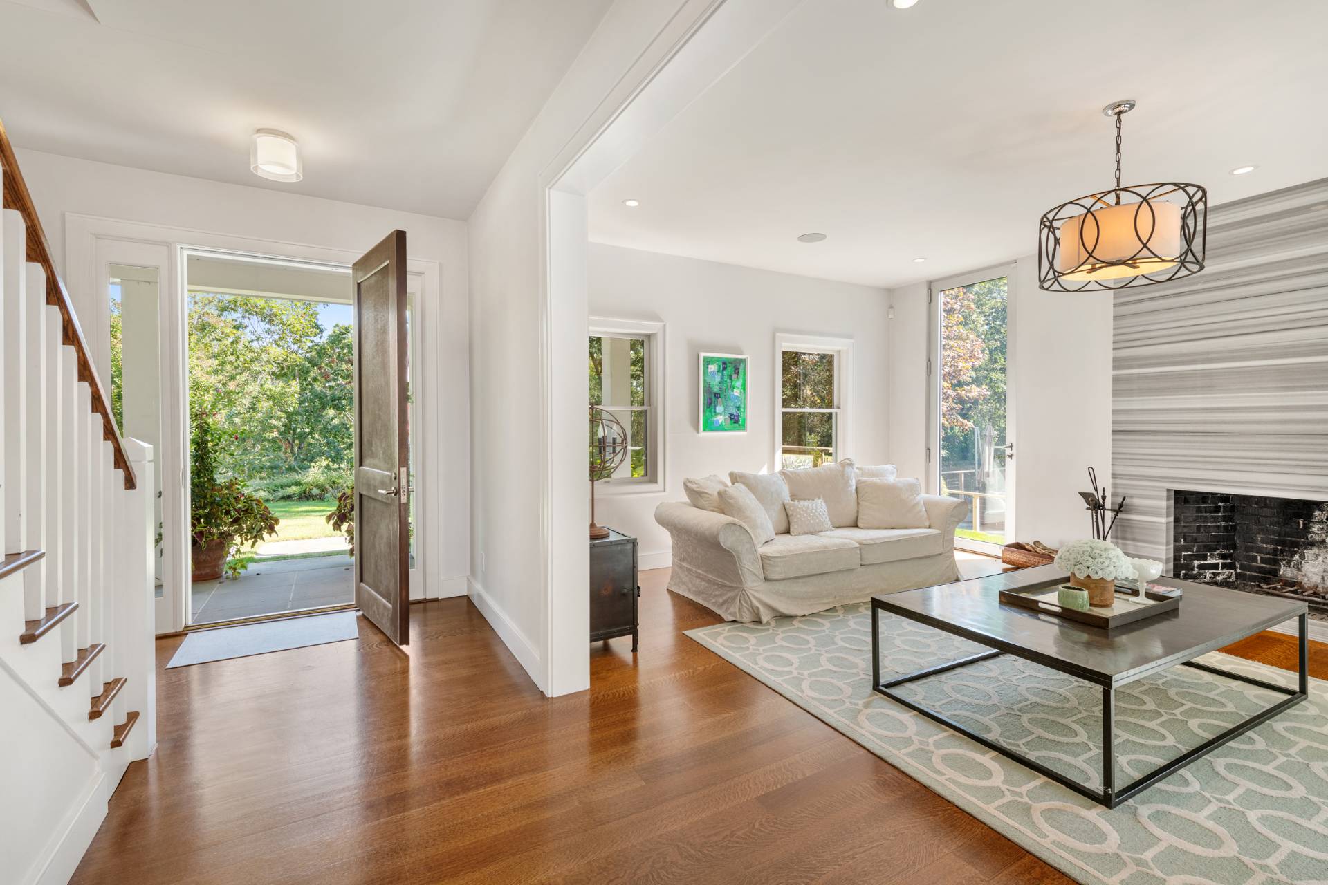 Undisclosed Address Sag Harbor, NY 11963 - Photo 6 of 36 a living room with fireplace furniture and a wooden floor