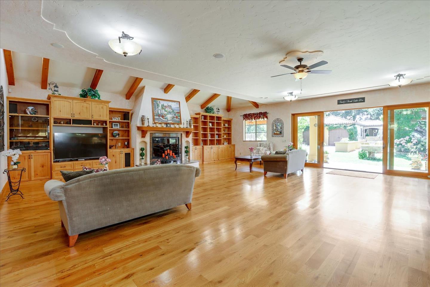 10091 Byrne Avenue Cupertino, CA 95014 - Photo 11 of 21 a living room with furniture and a flat screen tv