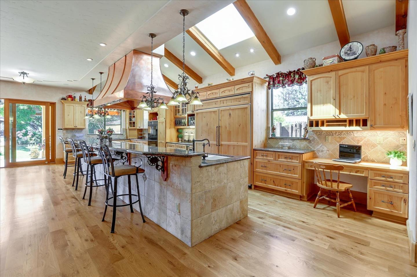 10091 Byrne Avenue Cupertino, CA 95014 - Photo 12 of 21 a large room with lots of wooden furniture and a chandelier