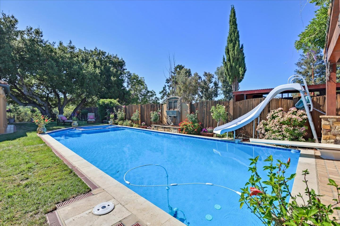 10091 Byrne Avenue Cupertino, CA 95014 - Photo 13 of 21 a view of a backyard with plants and a barbeque
