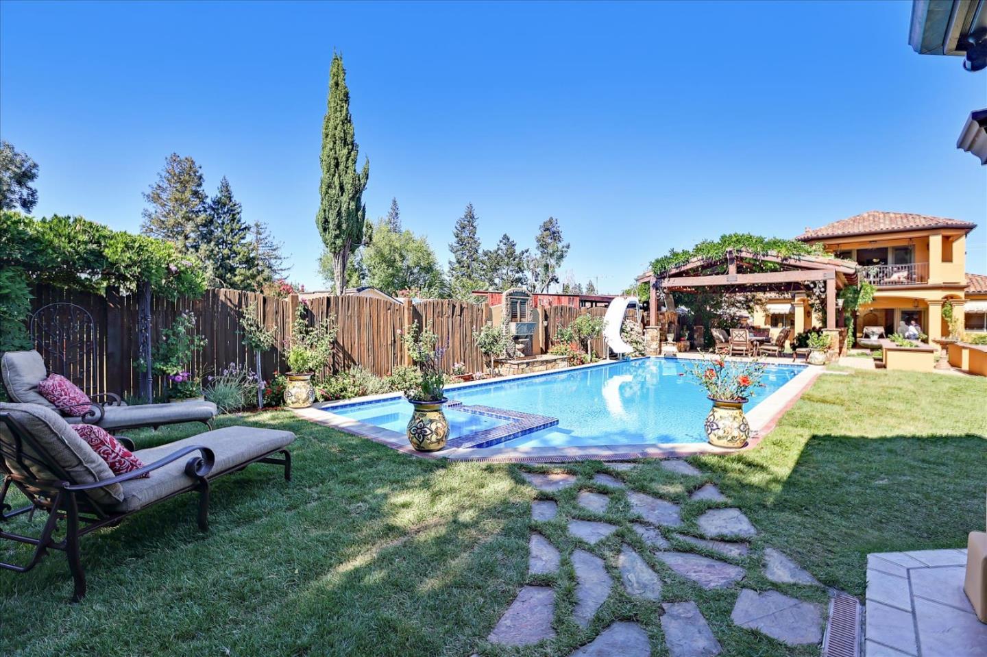 10091 Byrne Avenue Cupertino, CA 95014 - Photo 14 of 21 a view of a house with a yard porch and sitting area