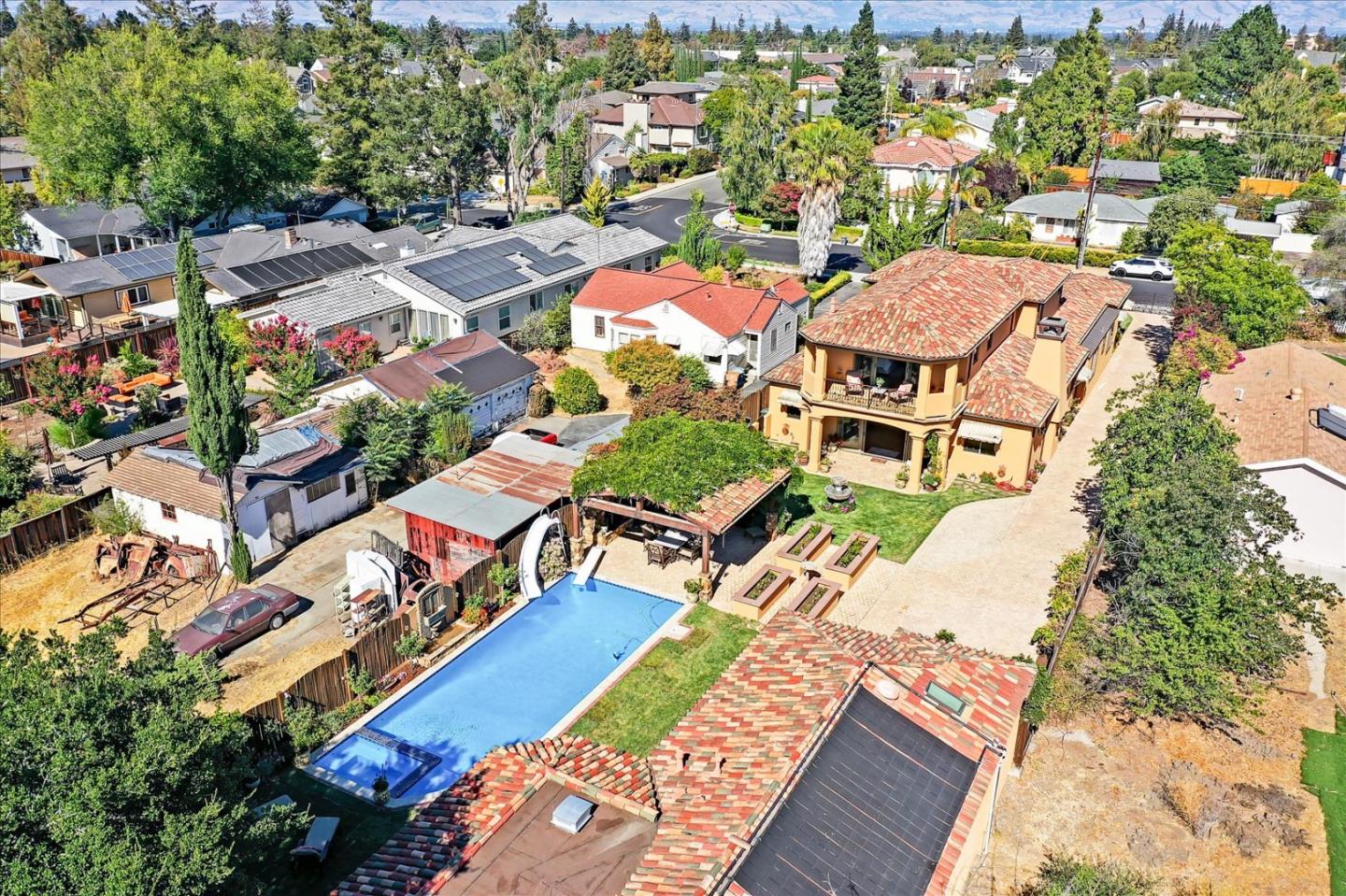 10091 Byrne Avenue Cupertino, CA 95014 - Photo 3 of 21 an aerial view of residential houses and outdoor space