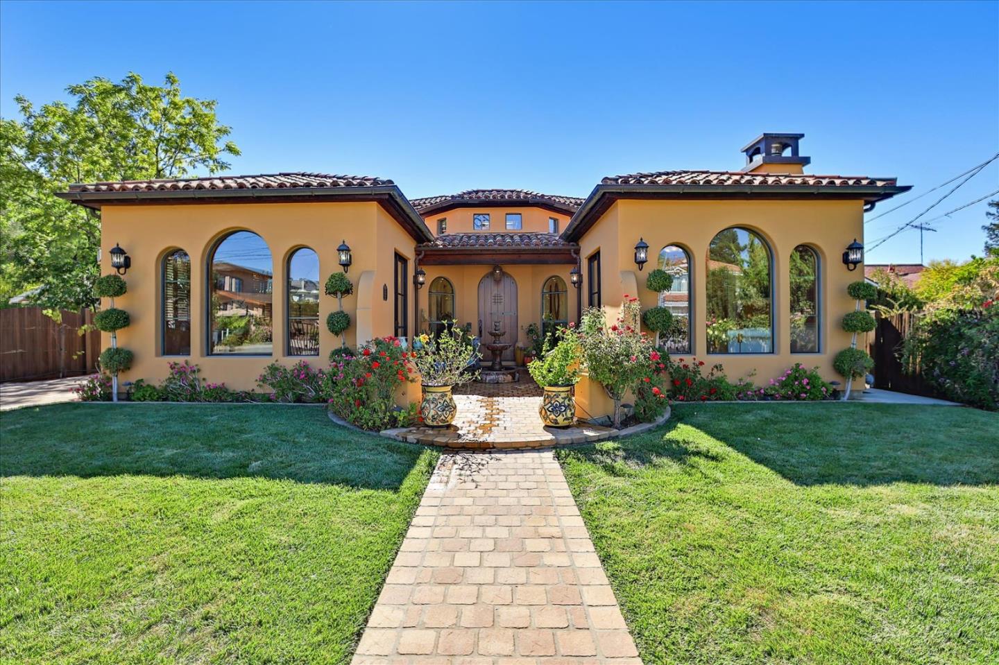 10091 Byrne Avenue Cupertino, CA 95014 - Photo 5 of 21 a front view of a house with garden