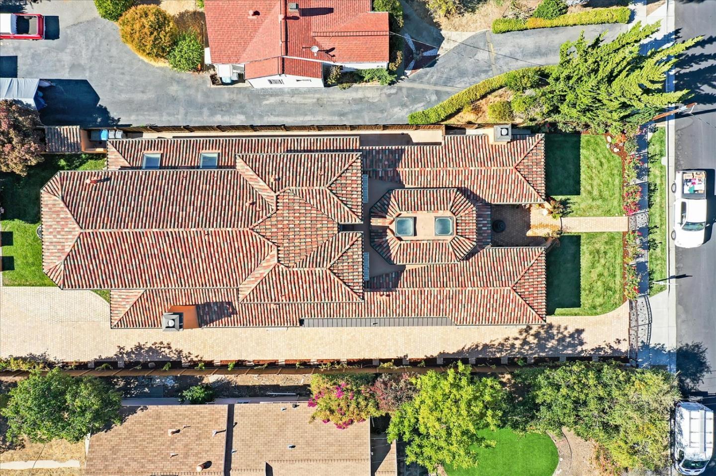 10091 Byrne Avenue Cupertino, CA 95014 - Photo 7 of 21 an aerial view of a house with a yard and large trees