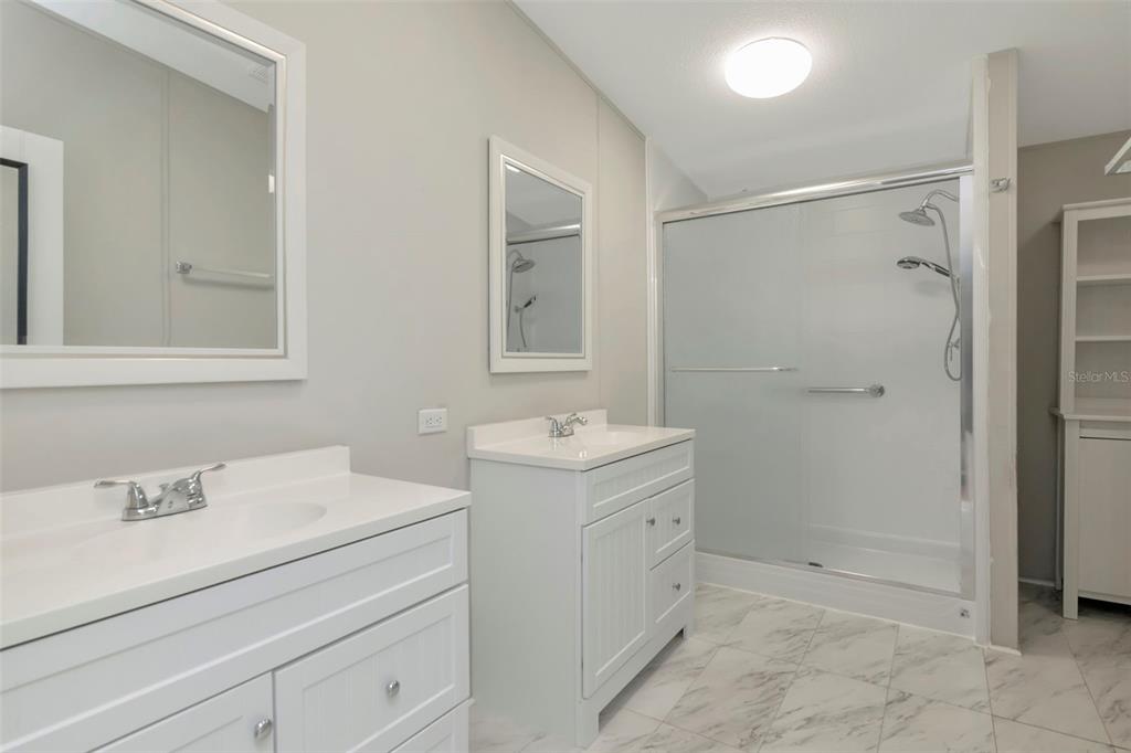 5213 R M D Avenue Plant City, FL 33566 - Photo 21 of 32 a bathroom with a sink a toilet and shower