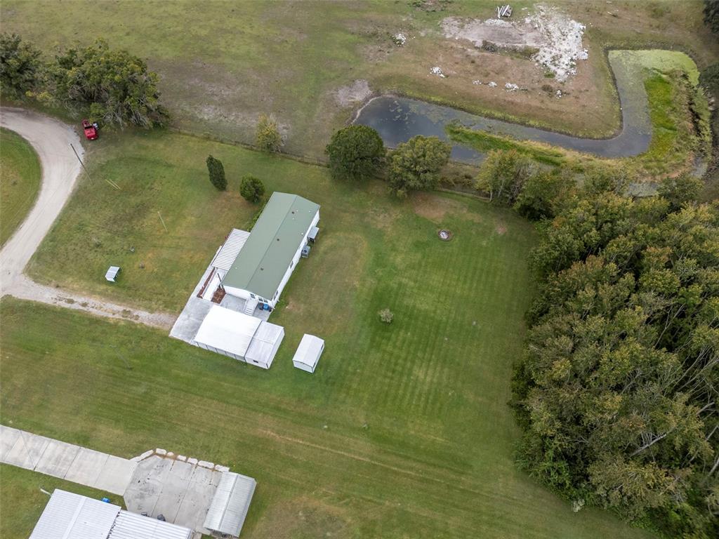 5213 R M D Avenue Plant City, FL 33566 - Photo 3 of 32 an aerial view of a house with a yard