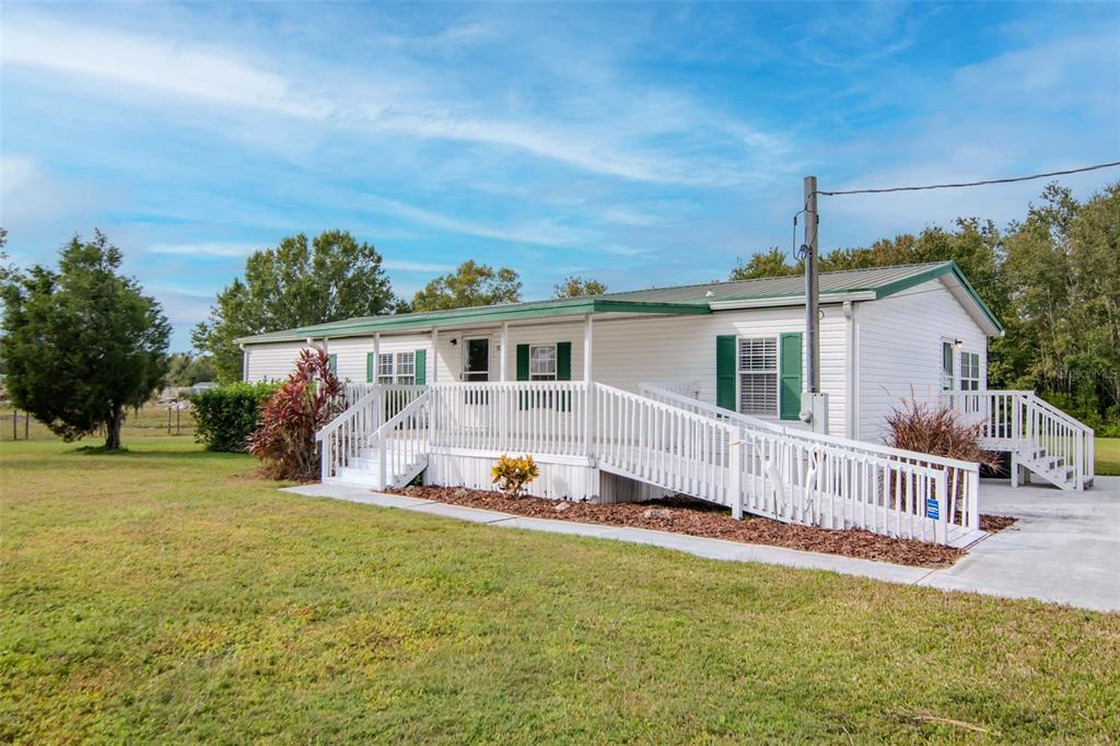 5213 R M D Avenue Plant City, FL 33566 - Photo 6 of 32 front view of a house with a yard