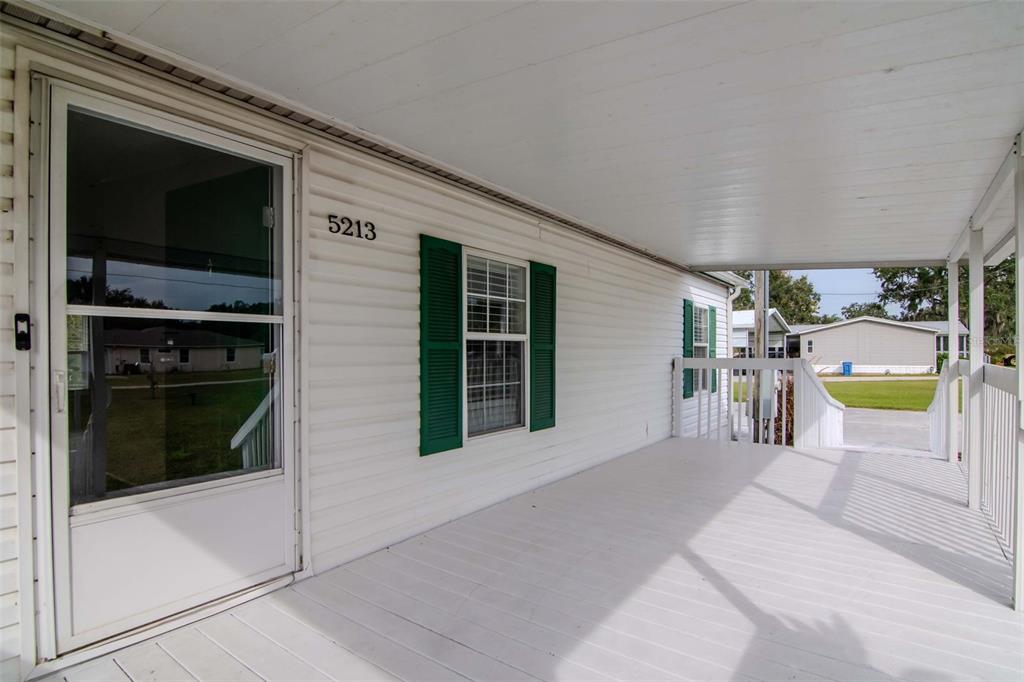 5213 R M D Avenue Plant City, FL 33566 - Photo 8 of 32 a view of a living room and a kitchen