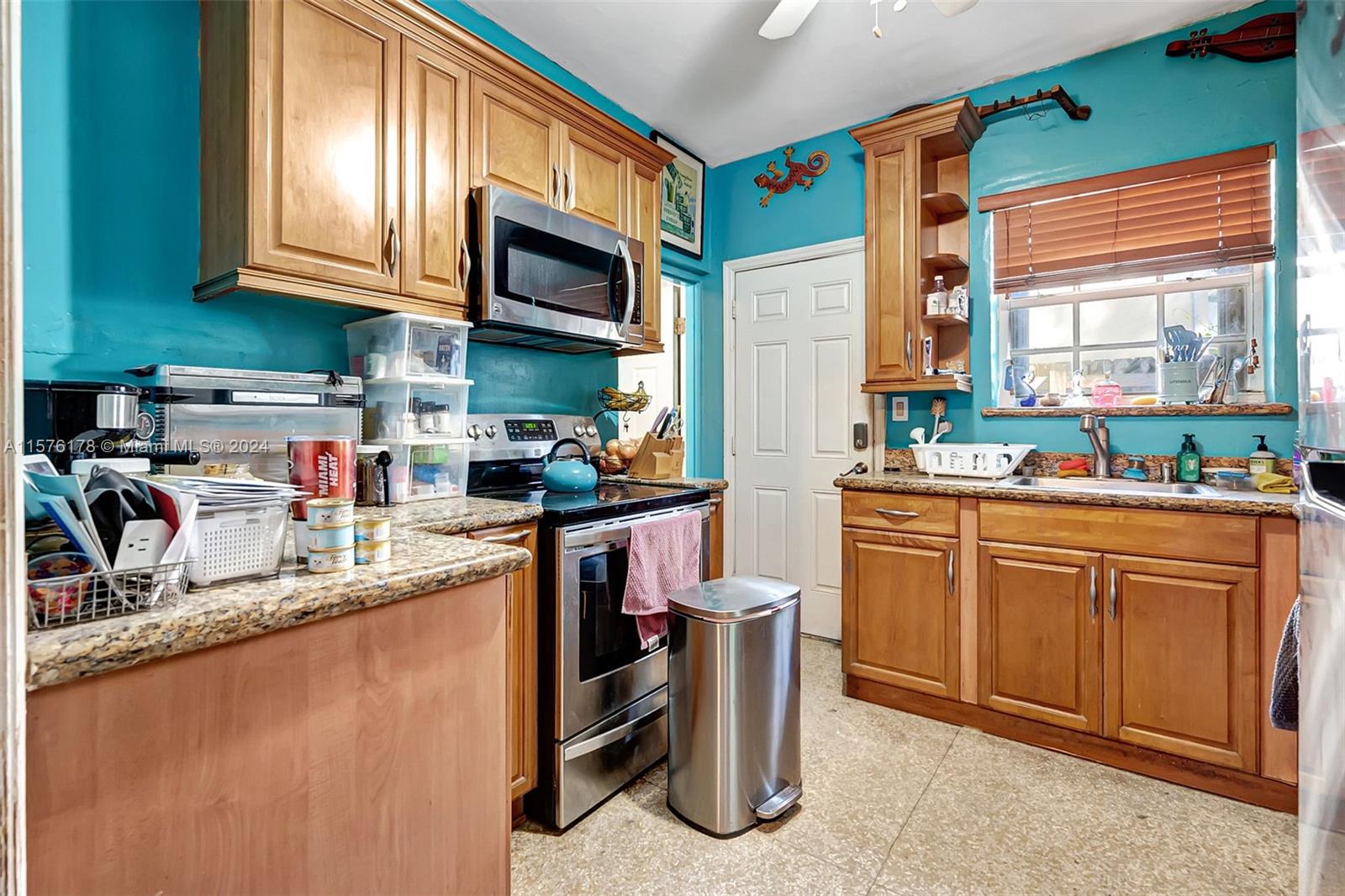 351 Southwest 22nd Road Miami, FL 33129 - Photo 11 of 27 a kitchen with stainless steel appliances granite countertop a refrigerator and a stove top oven