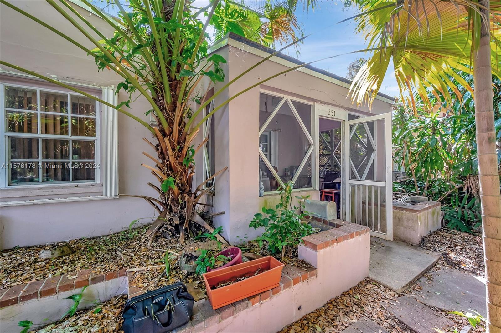 351 Southwest 22nd Road Miami, FL 33129 - Photo 3 of 27 a front view of a house with garden