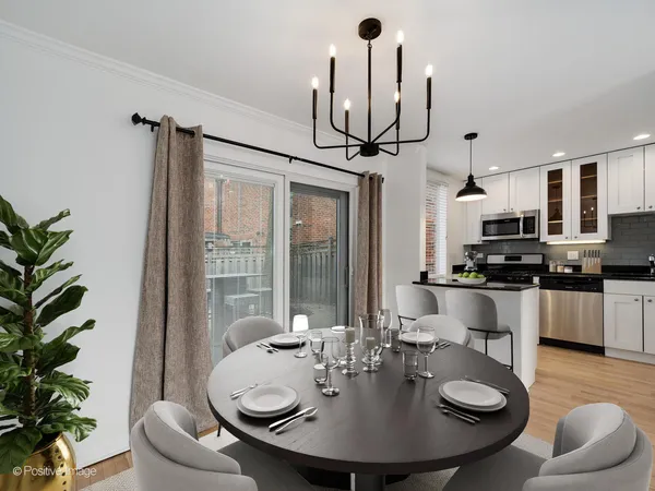 a kitchen with stainless steel appliances granite countertop white cabinets and black stove top oven with granite countertops