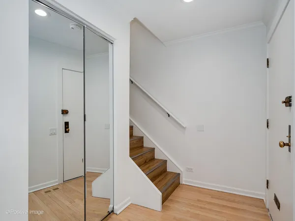 a view of an empty room with glass door