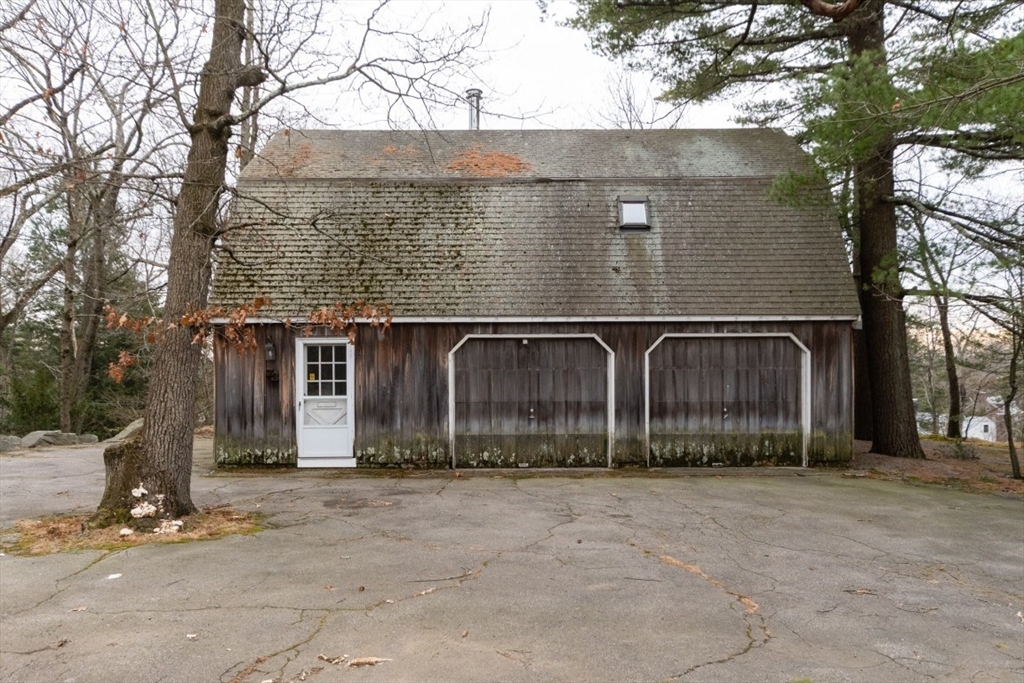 73 Valentine Street Newton, MA 02465 - Photo 3 of 6 a front view of a house with large trees
