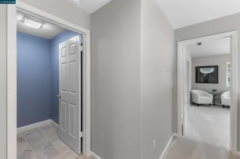 a bedroom with a bed and large window