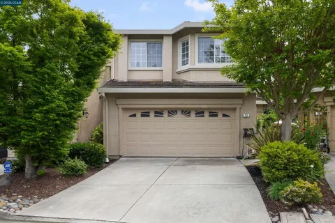 a front view of a house with a garage