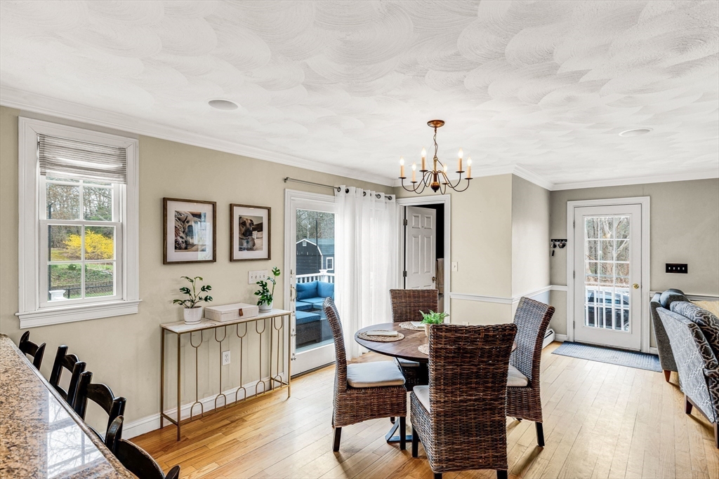 54 Old Merrill Street Amesbury, MA 01913 - Photo 13 of 34 a view of a dining room with furniture and chandelier