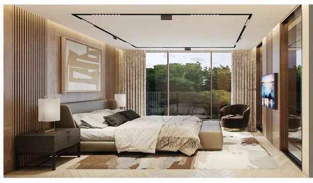 a large bedroom with a bed and wooden floor