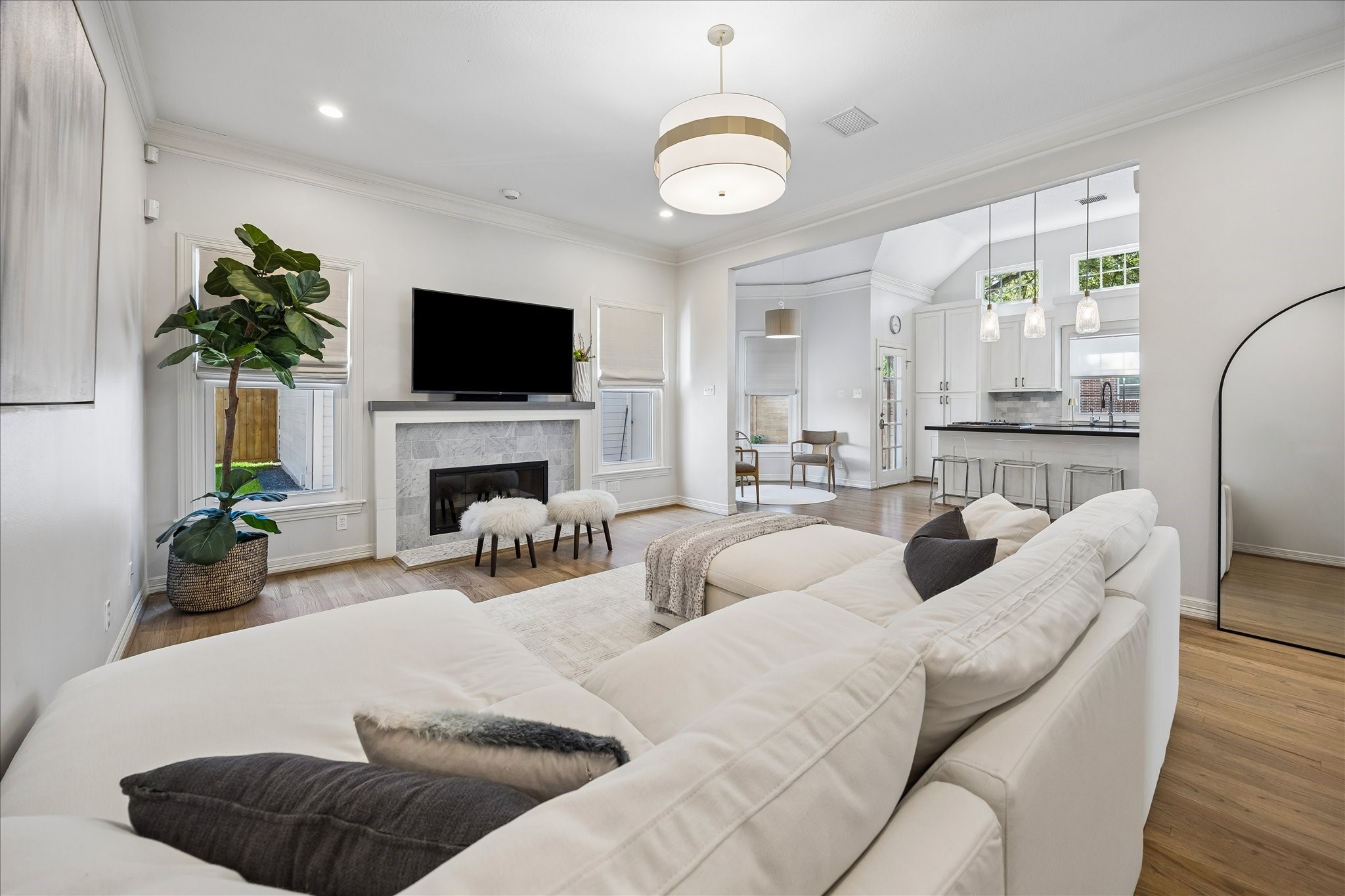 4131 Sunset Boulevard Houston, TX 77005 - Photo 13 of 38 a living room with furniture a flat screen tv and a fireplace