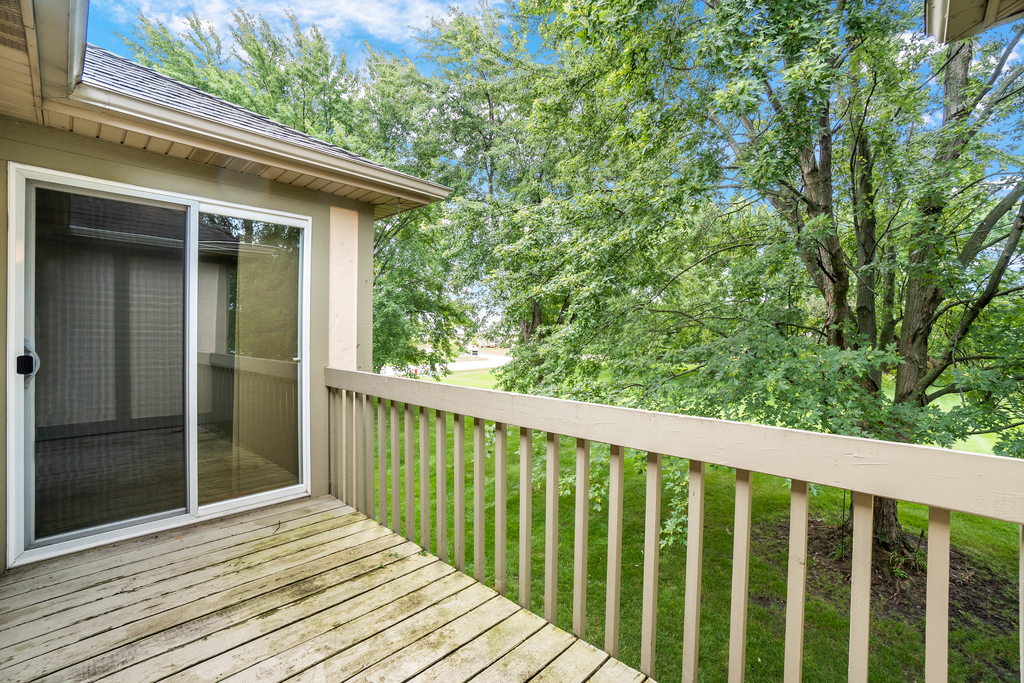 812 Meadow Ridge Lane, Unit 107 New Lenox, IL 60451 - Photo 14 of 15 a view of balcony with wooden floor