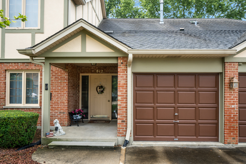 812 Meadow Ridge Lane, Unit 107 New Lenox, IL 60451 - Photo 2 of 15 a view of a house with a wooden door