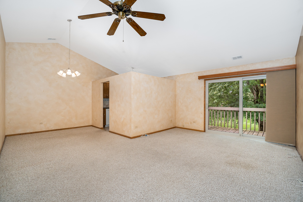 812 Meadow Ridge Lane, Unit 107 New Lenox, IL 60451 - Photo 5 of 15 a view of an empty room with a window