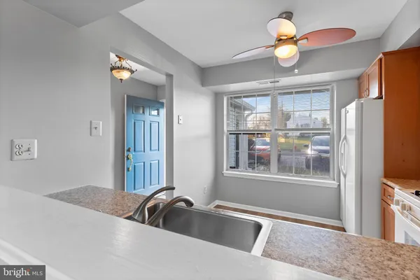a view of a livingroom with furniture and a window