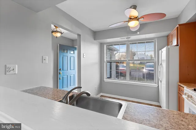 a view of a livingroom with furniture and a window