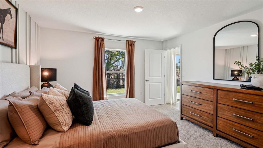 4026 Kona Circle Spring Hill, FL 34608 - Photo 12 of 26 a bedroom with a bed and a dresser