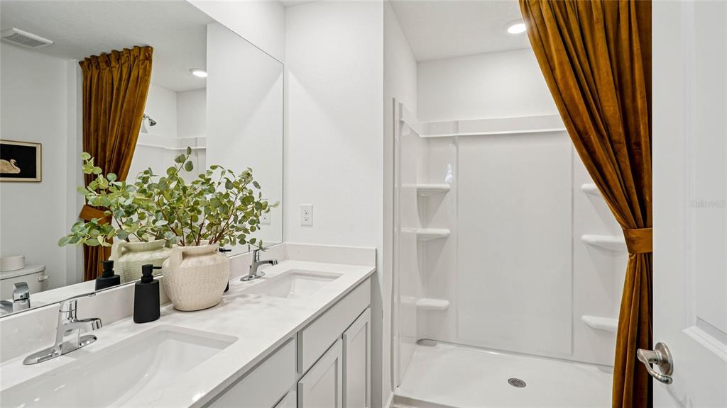 4026 Kona Circle Spring Hill, FL 34608 - Photo 13 of 26 a bathroom with a sink and a mirror