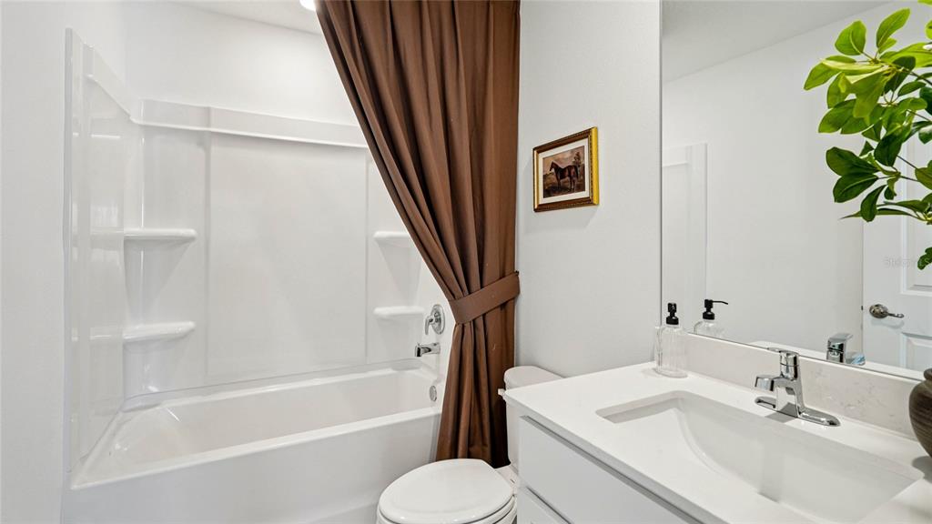 4026 Kona Circle Spring Hill, FL 34608 - Photo 17 of 26 a bathroom with a sink toilet and bathtub