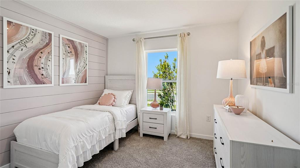 4026 Kona Circle Spring Hill, FL 34608 - Photo 18 of 26 a bedroom with a bed and a window