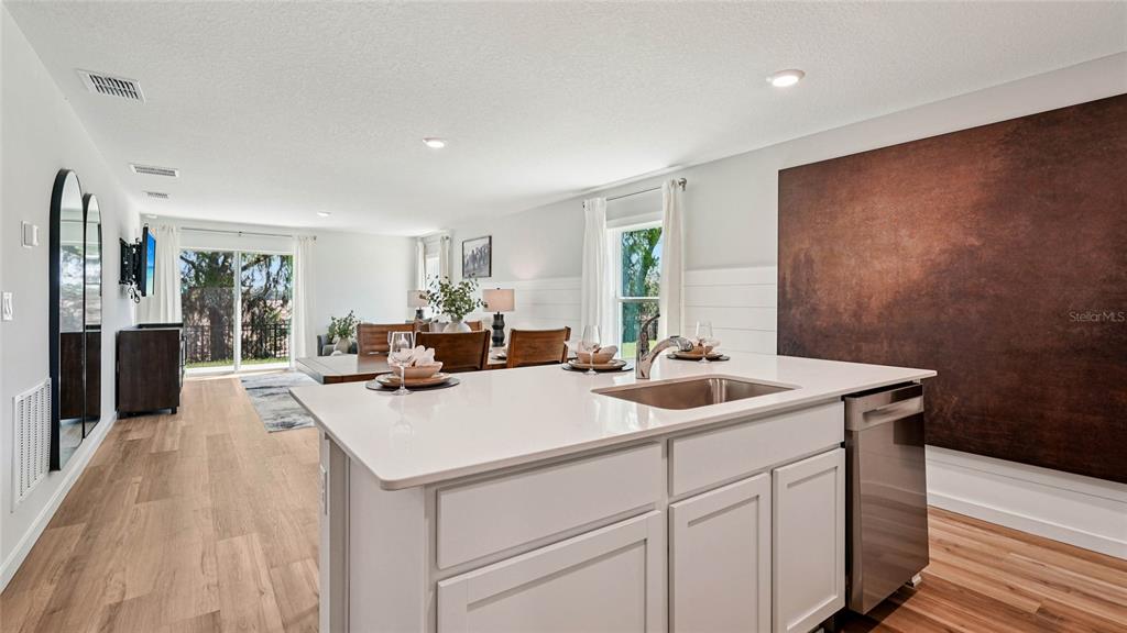 4026 Kona Circle Spring Hill, FL 34608 - Photo 4 of 26 a kitchen with a sink and cabinets