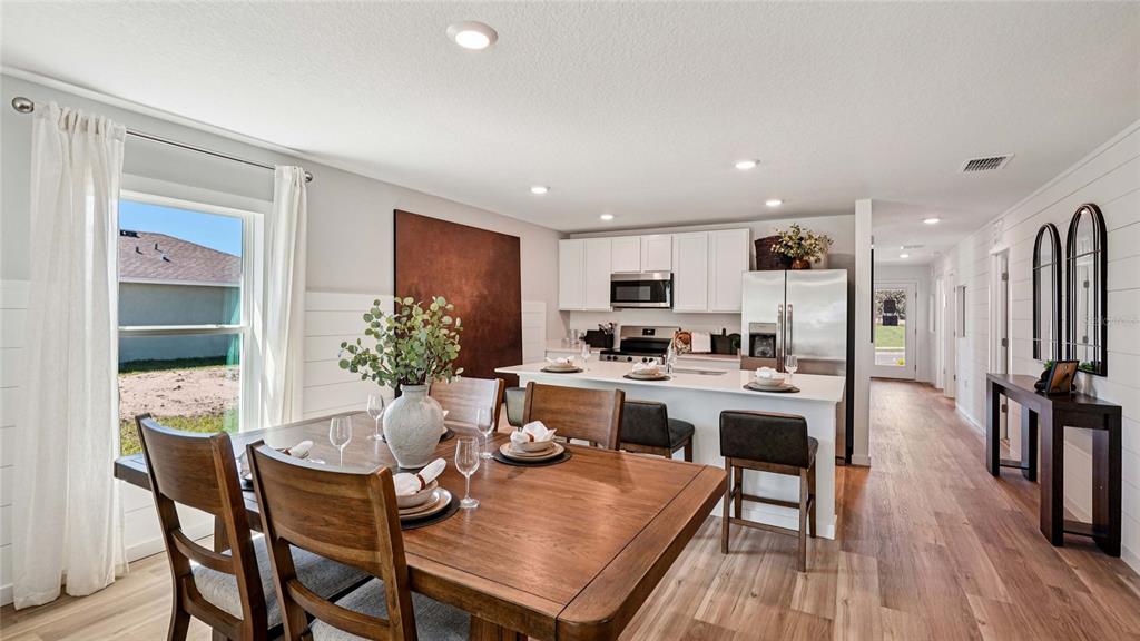 4026 Kona Circle Spring Hill, FL 34608 - Photo 6 of 26 a kitchen with a table and chairs in it