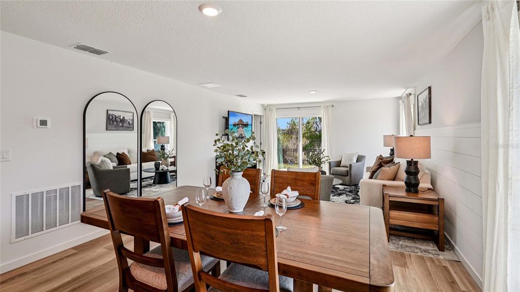 4026 Kona Circle Spring Hill, FL 34608 - Photo 7 of 26 a living room with furniture a couch and a potted plant
