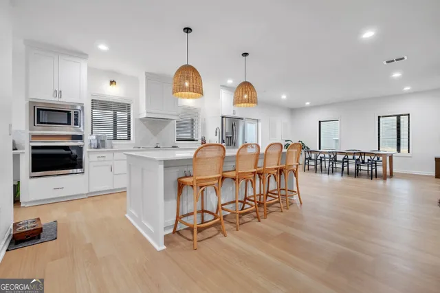 a view of kitchen with sink and microwave