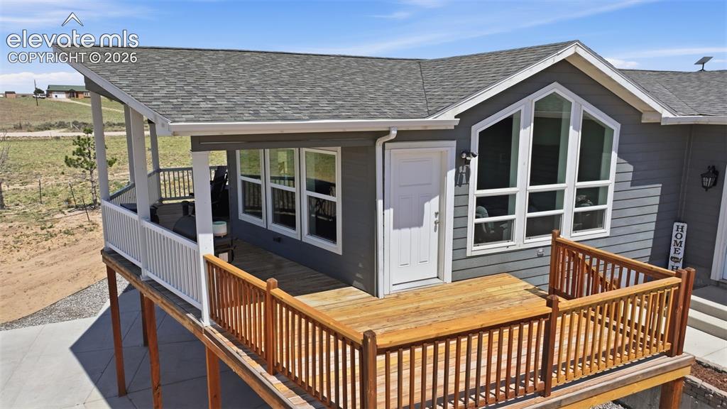 23335 Sanborn Road Calhan, CO 80808 - Photo 5 of 28 Covered upper deck with panoramic views and unforgettable Colorado sunsets, perfect for relaxing or entertaining friends and family