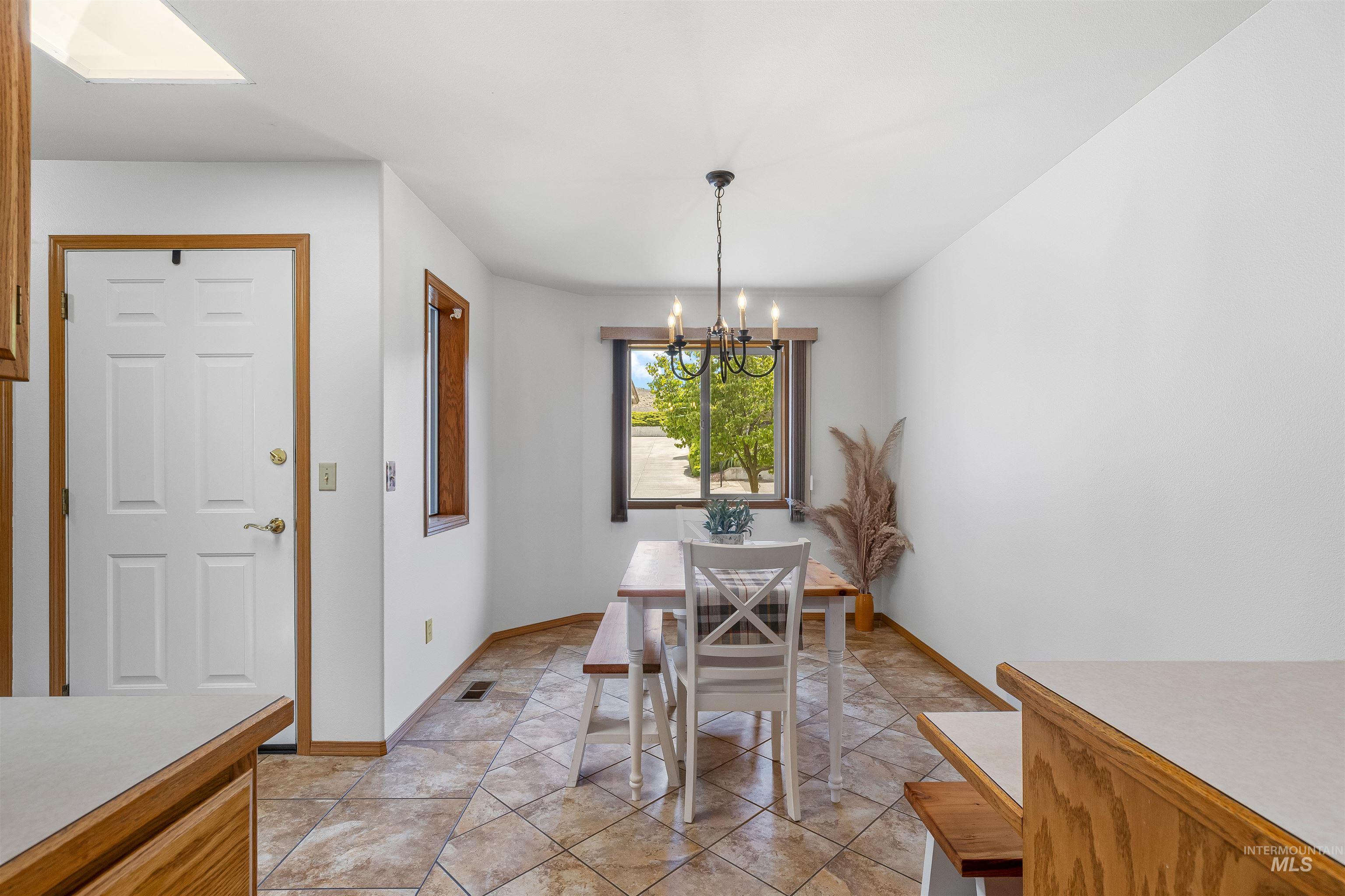 1409 29th Street Lewiston, ID 83501 - Photo 13 of 30 Dining room with hanging lights and light tile patterned floors