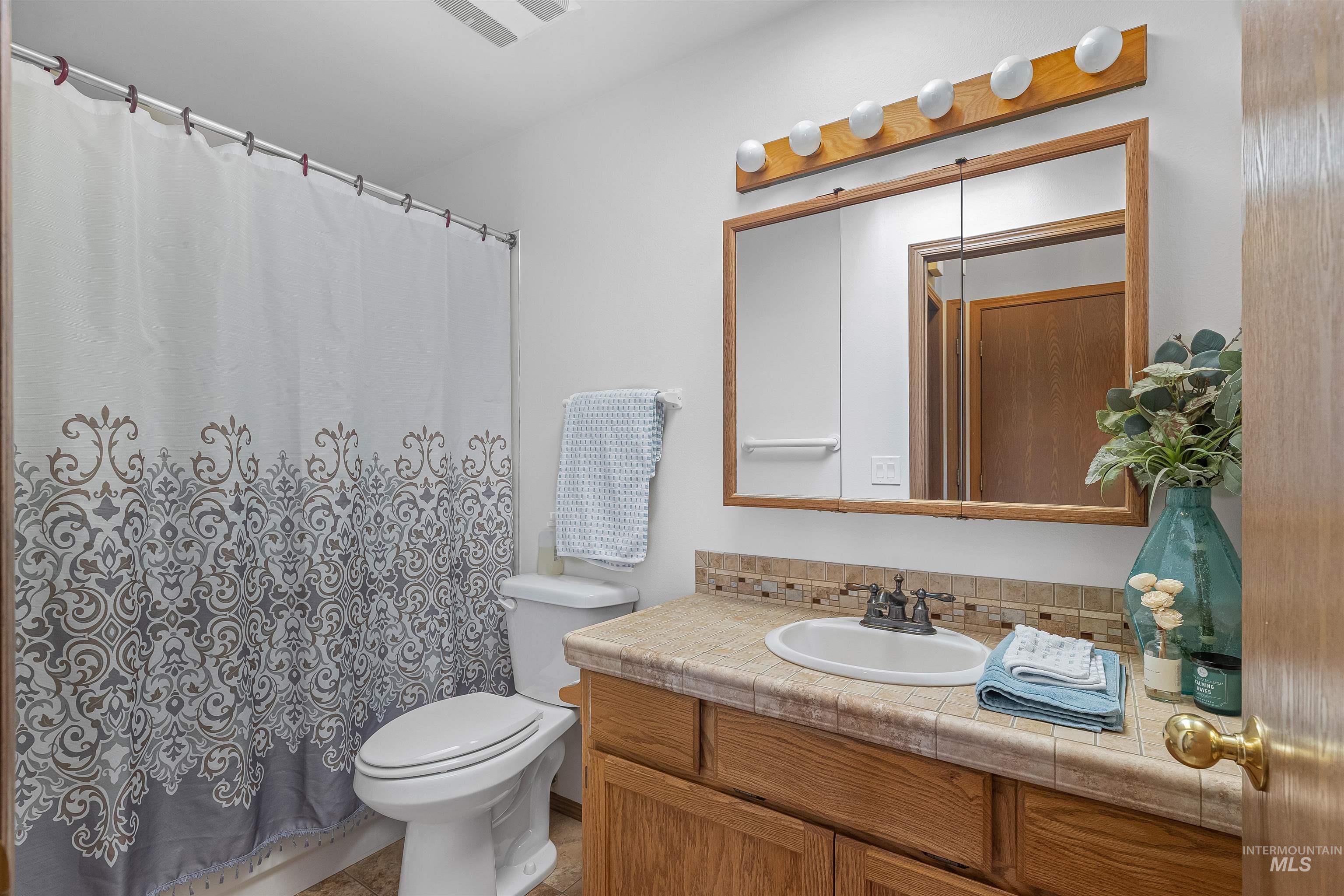 1409 29th Street Lewiston, ID 83501 - Photo 19 of 30 Full bathroom featuring vanity and toilet