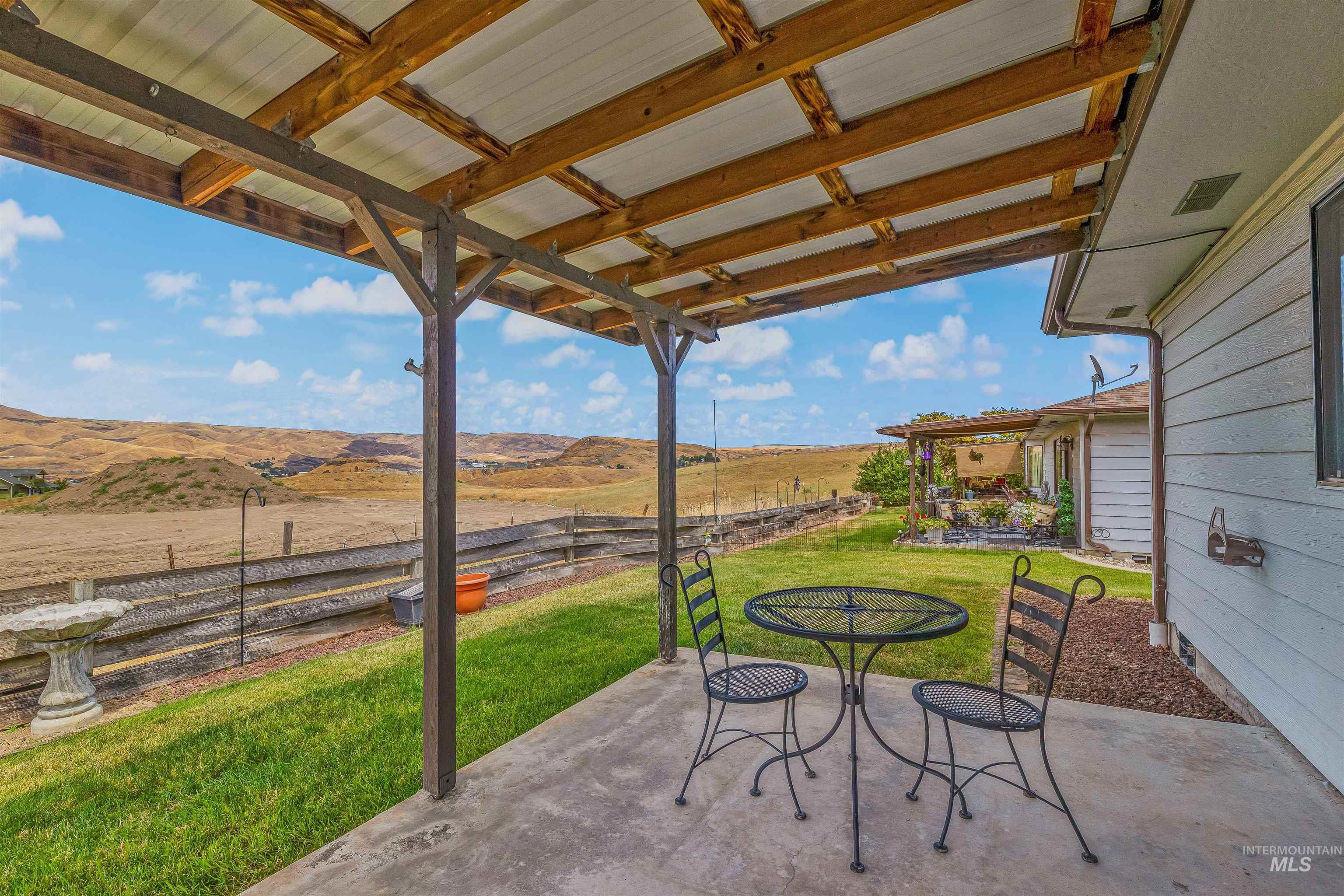 1409 29th Street Lewiston, ID 83501 - Photo 5 of 30 View of patio / terrace featuring outdoor dining area, a view of countryside, and a mountain view