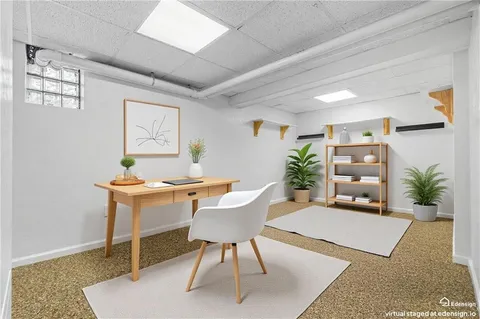 a workspace with furniture and window