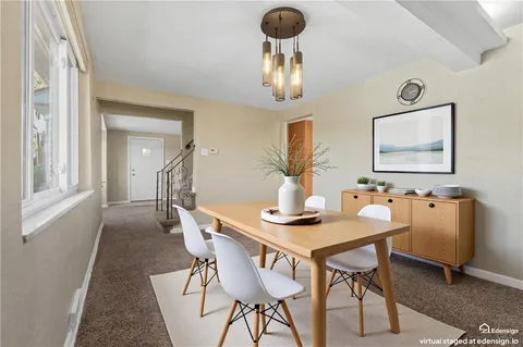a view of a dining room with furniture
