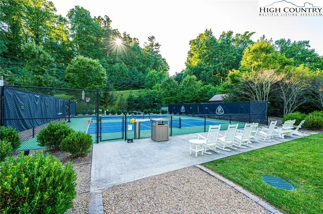 a view of a house with a porch and a garden