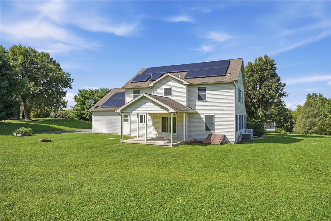 590 Fehr Road Nazareth, PA 18064 - Photo 66 of 79 A spacious green lawn surrounds this classic home featuring rooftop solar panels.