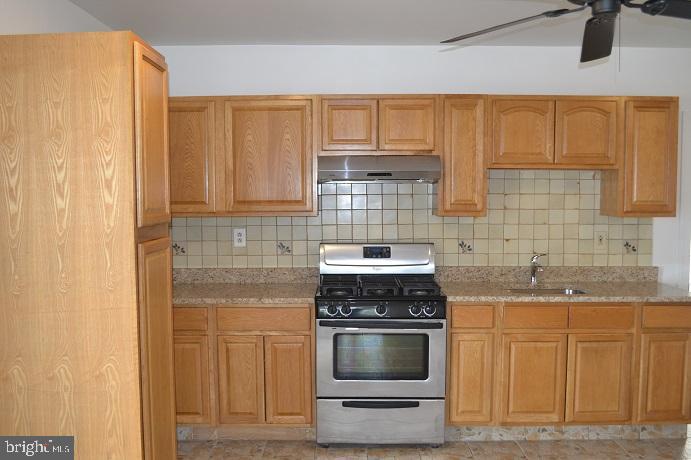 1664 Easton Road Willow Grove, PA 19090 - Photo 24 of 37 a kitchen with stainless steel appliances granite countertop a stove a sink and a microwave