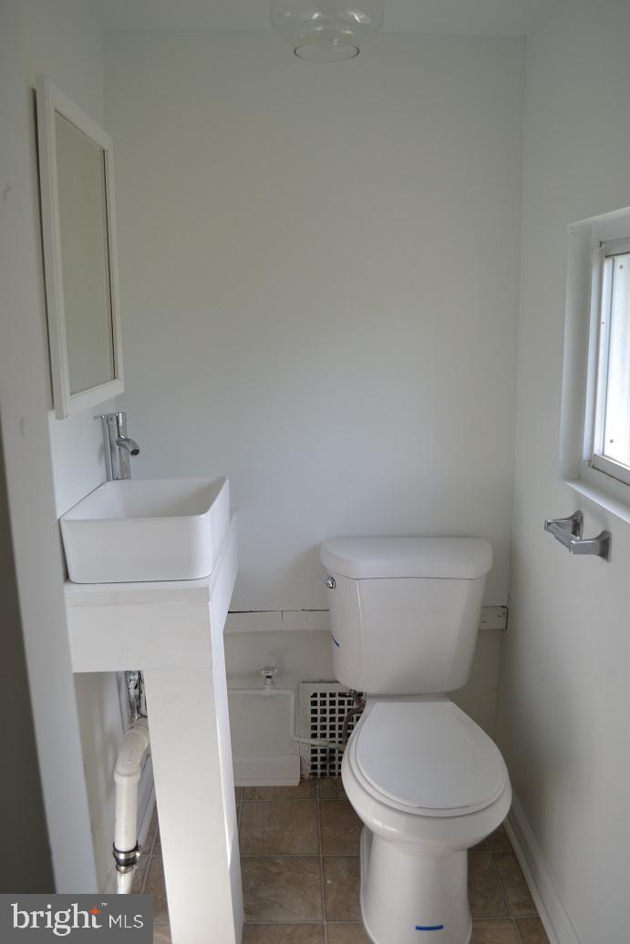 1664 Easton Road Willow Grove, PA 19090 - Photo 27 of 37 a white toilet sitting next to a bathroom sink