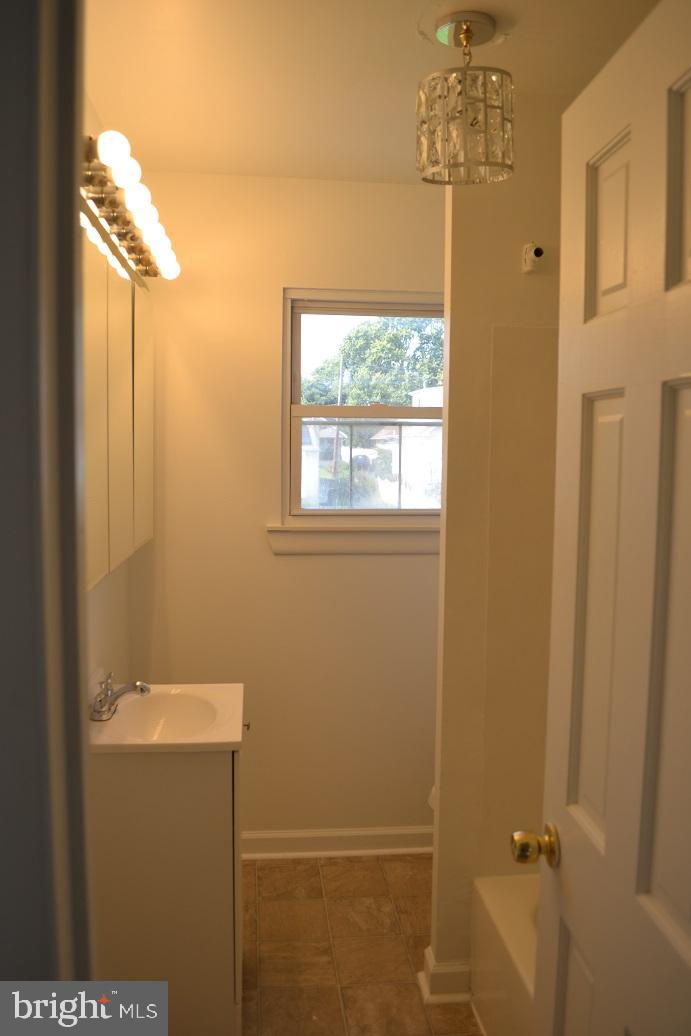 1664 Easton Road Willow Grove, PA 19090 - Photo 31 of 37 a bathroom with a window and a shower