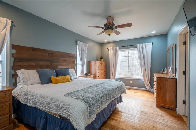 a bathroom with a granite countertop sink and a toilet