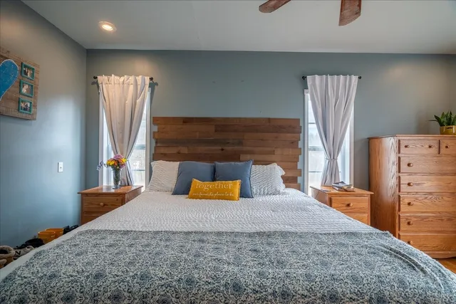 a bathroom with a toilet a sink and a mirror