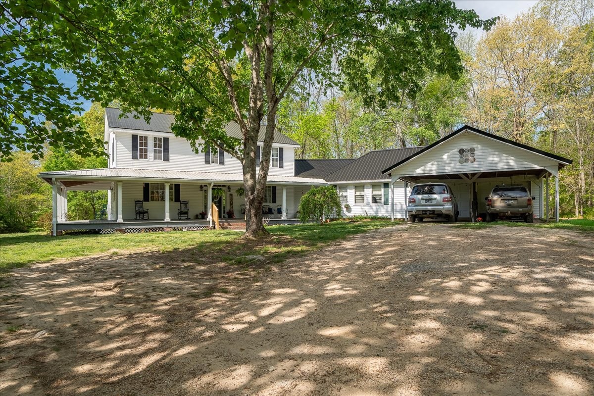 226 Nash Road Summertown, TN 38483 - Photo 2 of 55 a front view of a house with a yard and porch