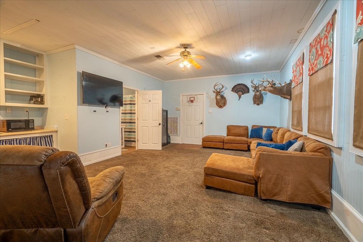 226 Nash Road Summertown, TN 38483 - Photo 23 of 55 a living room with furniture and a flat screen tv